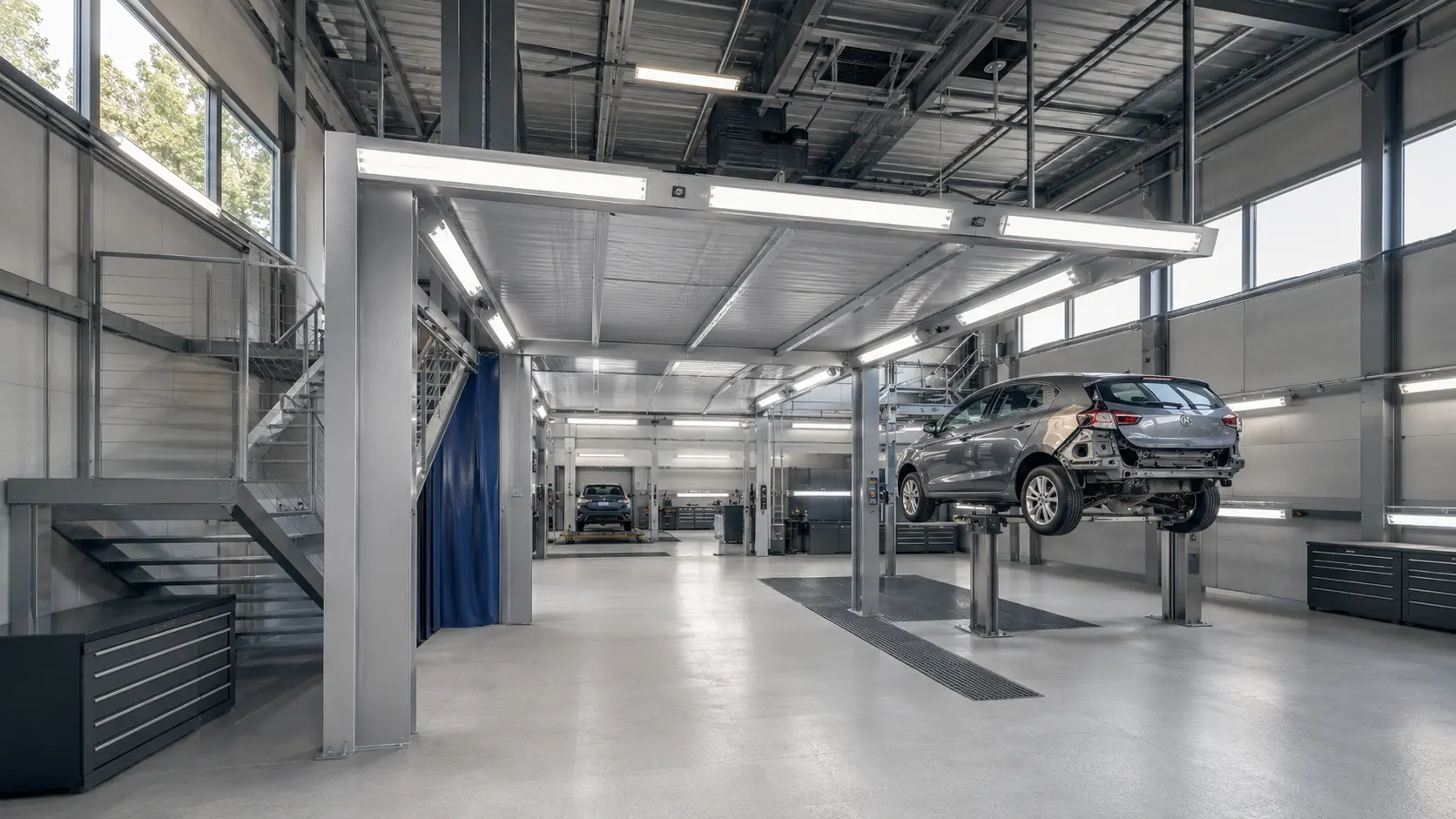 D.A.J.M.I. bodywork and paint workshop with a vehicle on a lift